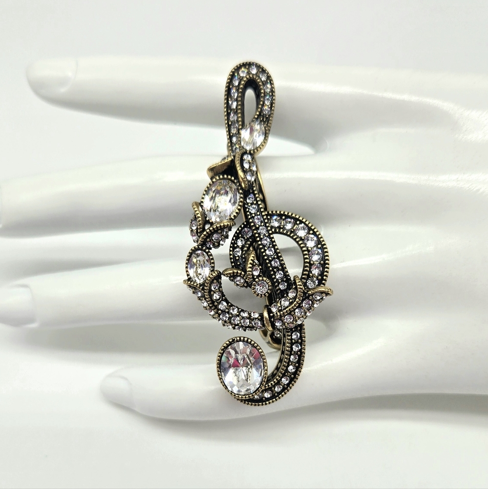 Heidi Daus Swarovski Crystal Treble Clef Two Finger Statement Ring in Bronze